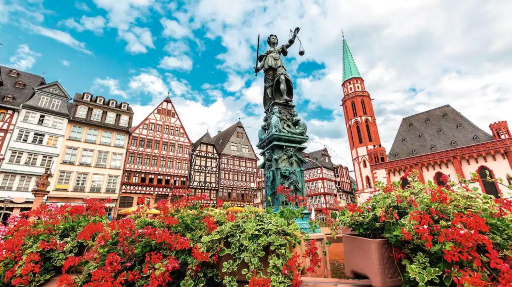 fountain of justice on the Roemerberg in the old city, Old St Nicholas Church in background, Frankfurt