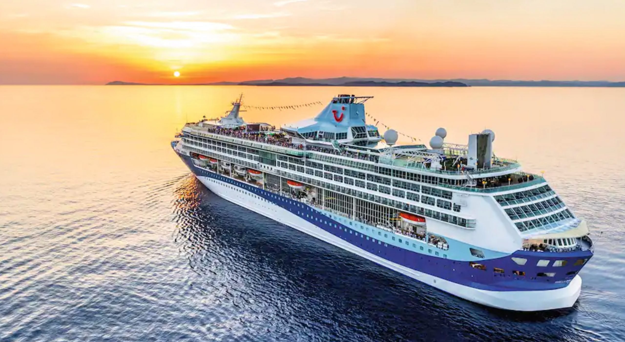 Marella cruise ship sailing into the sunset