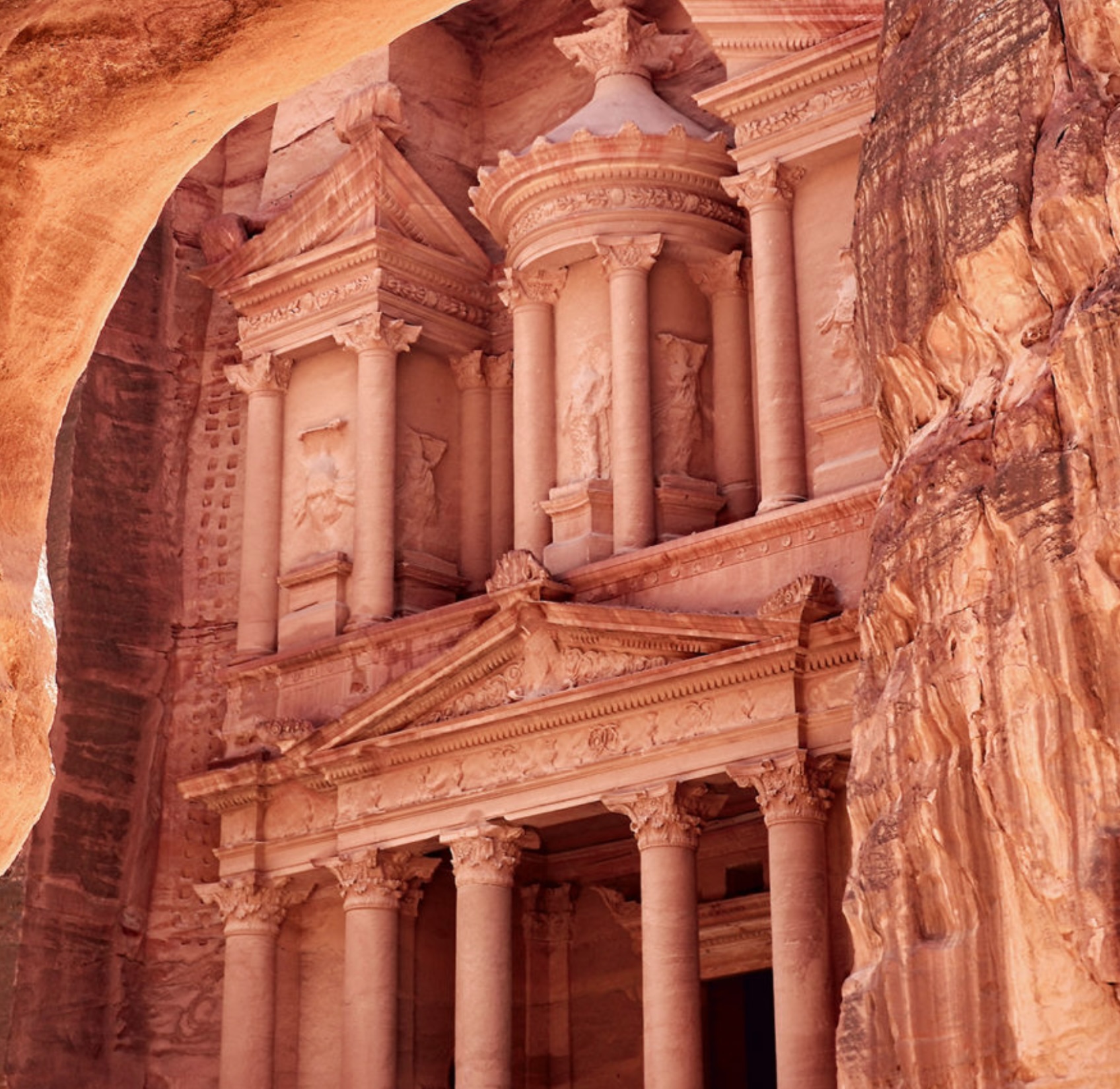 Discover Al-Khazneh (The Treasury), in the ancient rock-cut city in a deep valley at Petra, Jordan