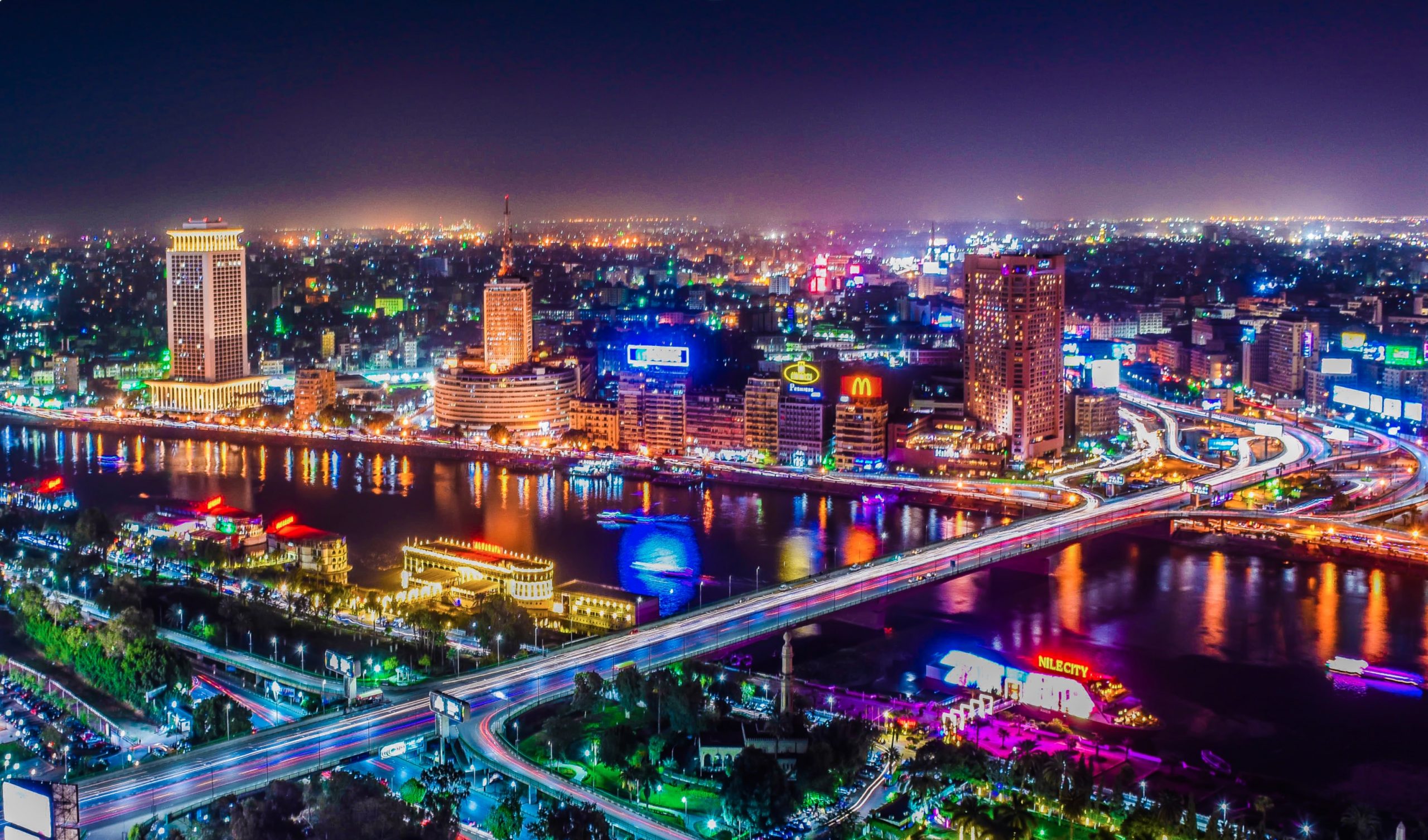 Cairo night-time cityscape with view across the Nile