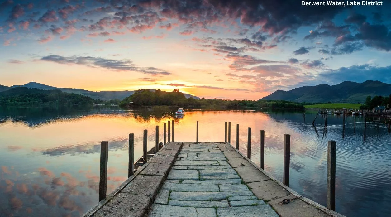 jetty into Derwent water, lake district with dramatic sunset